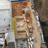 Aerial view of active commercial foundation construction site